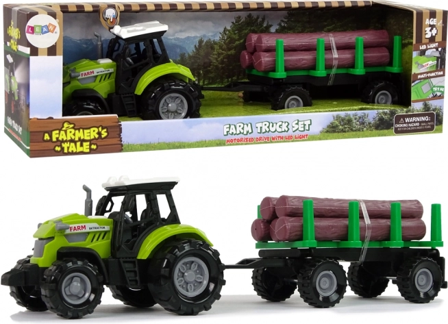 Zeleni traktor s prikolico za hlode z lučjo in zvoki