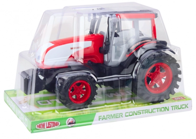 Velik kmetijski traktor s pogonom Rdeč