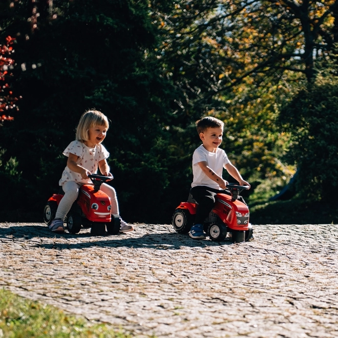 Poganjalec traktor Massey Ferguson rdeč s volanom in prikolico