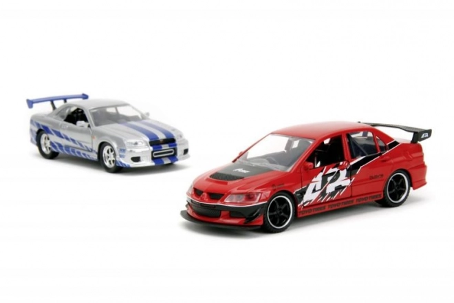 Hitri in drzni Twin Pack 2006 Mitsubishi Lancer Evo IX + Brianov 2002 Nissan Skyline GTR R34, 1:32 Val 4/2