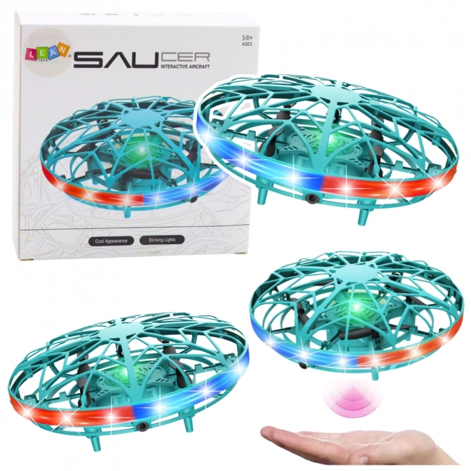 UFO dron lahko upravljan z roko z LED lučkami turkizne barve