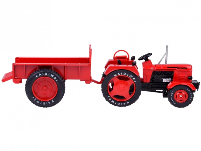 Rdeči kovinski traktor z gumijastimi kolesi 1:18