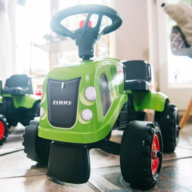 Poganjalec traktor Claas zelen z volanom in prikolico