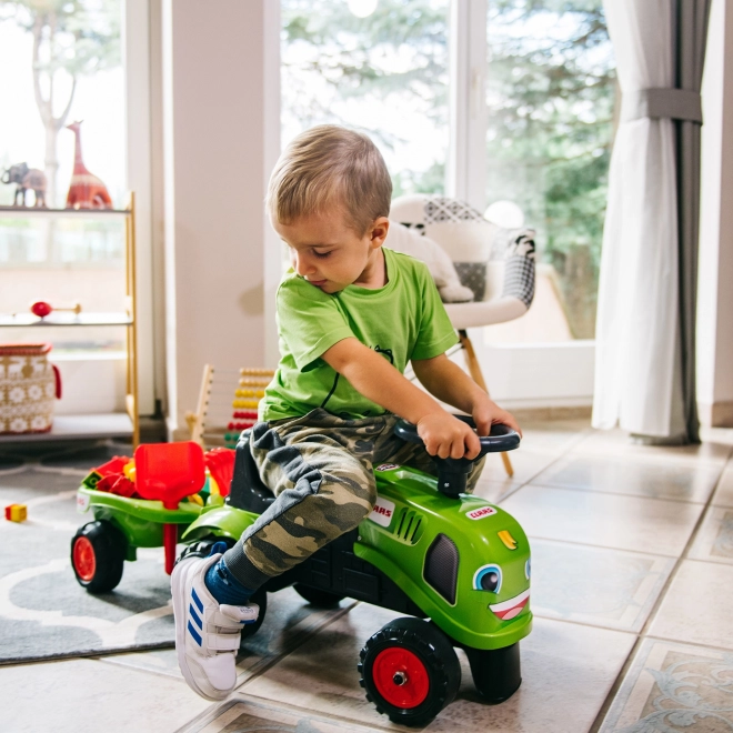 Poganjalec traktor Claas zelen z volanom in prikolico