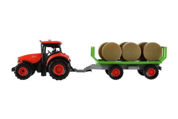 Traktor Zetor s prikolico in balami plast 36cm na vztrajnost na bat. z lučjo in zvokom v škat. 39x13