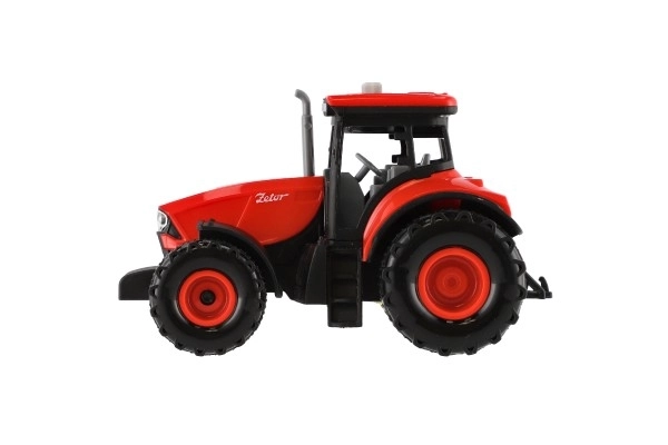 Rdeči traktor Zetor s vztrajnikom z zvočnimi in svetlobnimi učinki