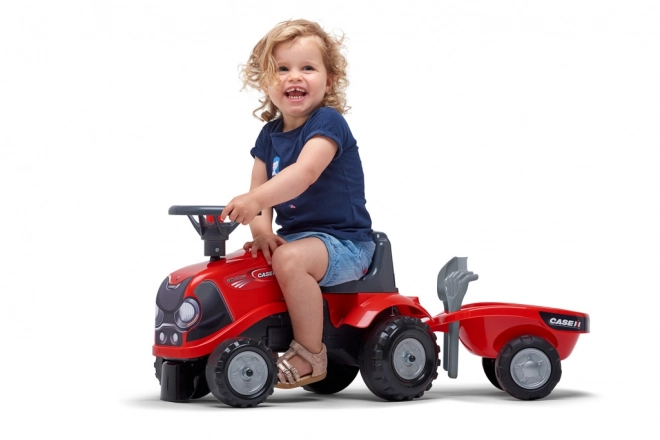 Vozeči traktor Baby Case IH rdeč s prikolico