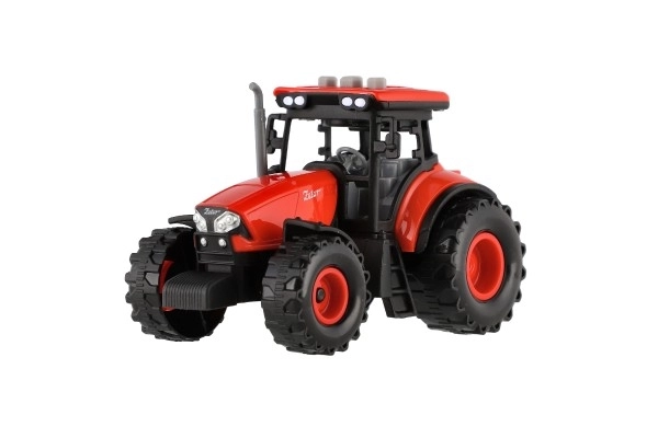 Rdeči traktor Zetor s vztrajnikom z zvočnimi in svetlobnimi učinki