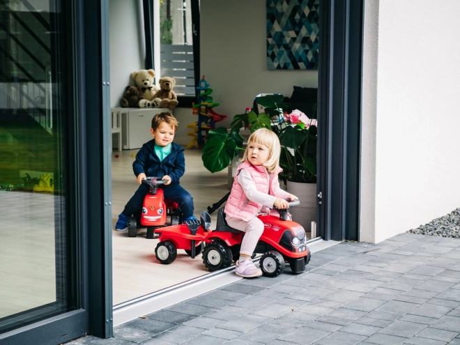Vozeči traktor Baby Case IH rdeč s prikolico