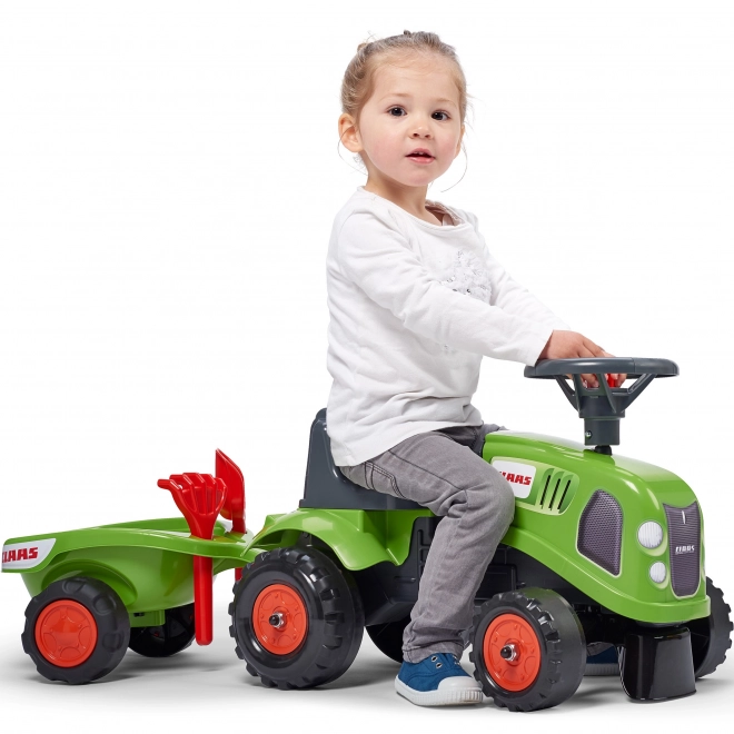 Poganjalec traktor Claas zelen z volanom in prikolico