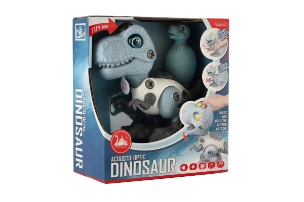Dinozaver vijačen plastičen 12cm z izvijačem na baterije s svetlobo in zvokom v škatlici 15x16x7cm