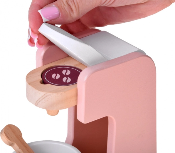 Kavni aparat na kapsule s skodelico in žličko