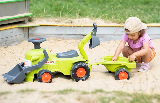 Vozni traktor Claas s prikolico, nakladalnikom in žlico