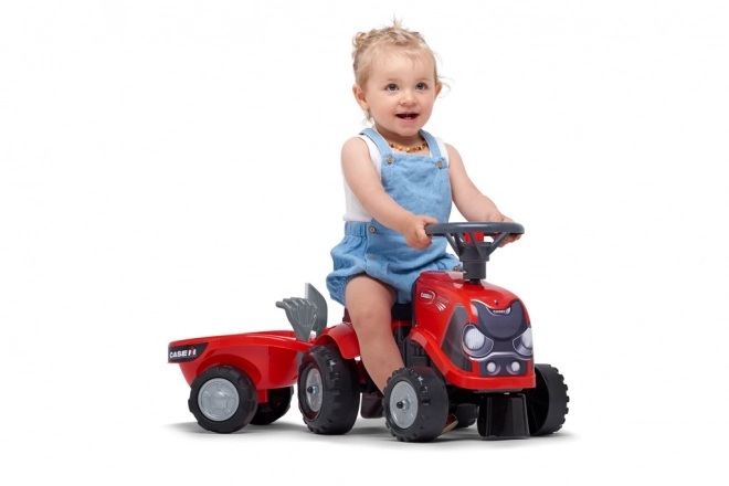 Vozeči traktor Baby Case IH rdeč s prikolico