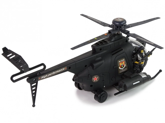 Vojni helikopter s krili in svetlobnimi učinki na baterije