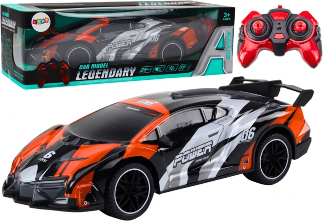 RC športni avto 1:10 sivo‑oranžen do 25 km/h