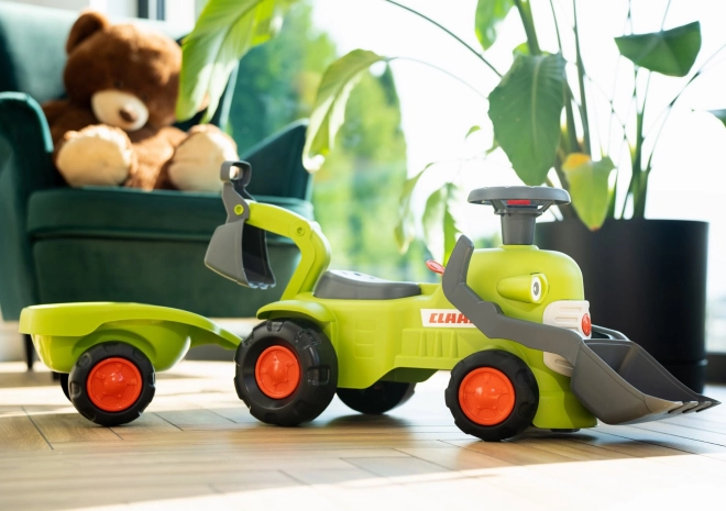 Vozni traktor Claas s prikolico, nakladalnikom in žlico