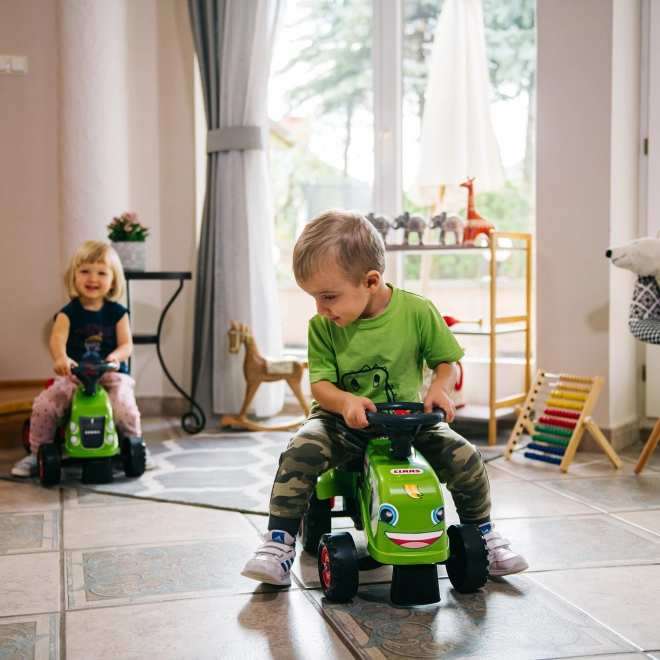 Poganjalec traktor Claas zelen z volanom in prikolico