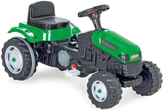 Zeleni pedalni traktor