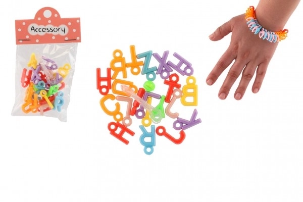 Plastični biseri srce z vrvico, črke 2 vrste v vrečki 6,5x11x1cm