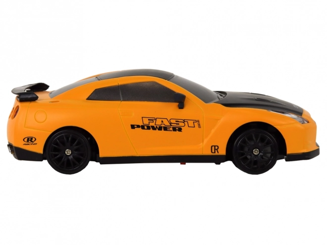 Športni avto R/C 1:24 na daljinsko upravljanje z zamenljivimi kolesi – rumeni