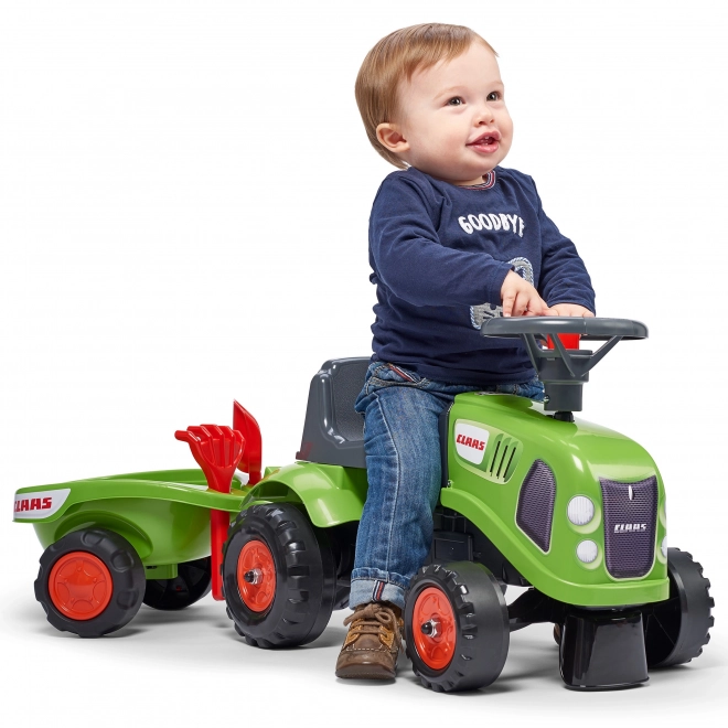 Poganjalec traktor Claas zelen z volanom in prikolico