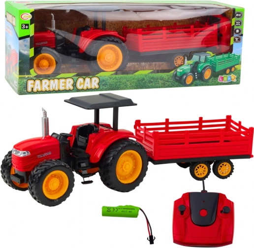 Daljinsko vodeni kmečki traktor s prikolico rdeč