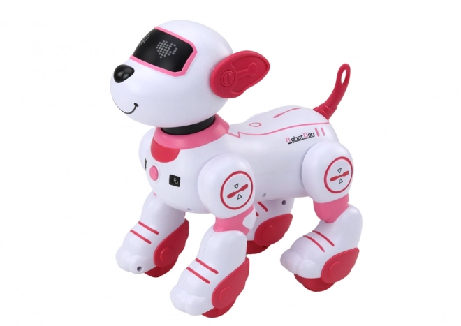 Interaktivni robotski pes na daljinsko upravljanje pleše in izvaja ukaze roza