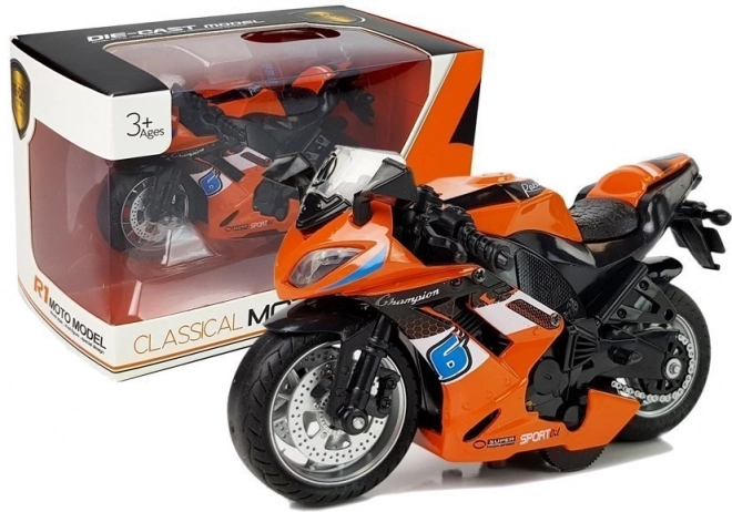 Oranžna igrača motorno kolo z pogonom