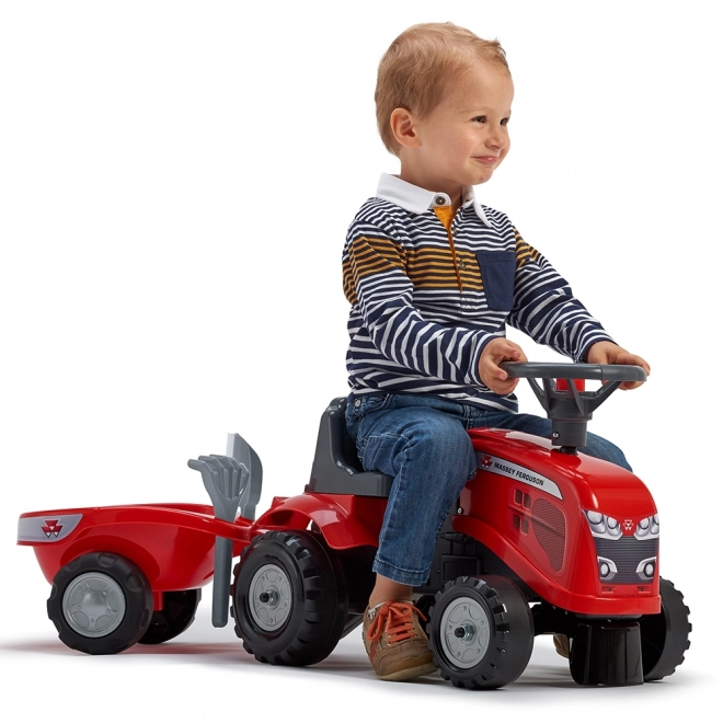 Poganjalec traktor Massey Ferguson rdeč s volanom in prikolico