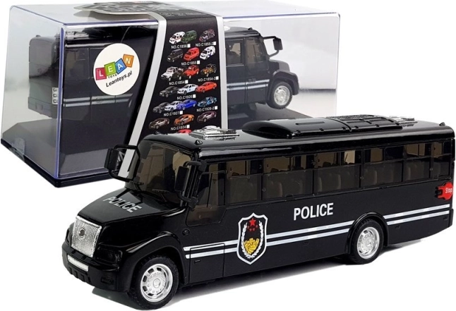 Črni policijski avtobus z vztrajnikom in zvokom