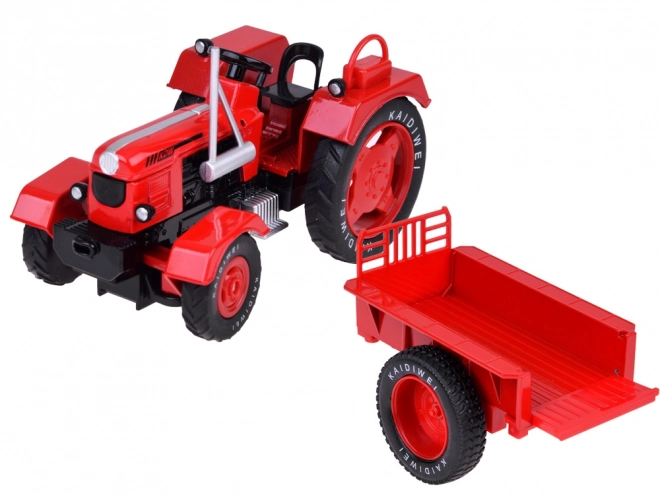 Rdeči kovinski traktor z gumijastimi kolesi 1:18