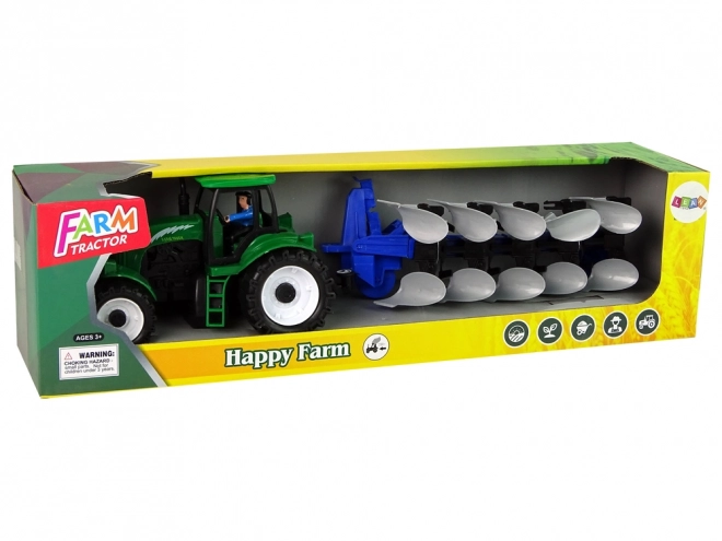 Zeleni kmetijski traktor s plugom