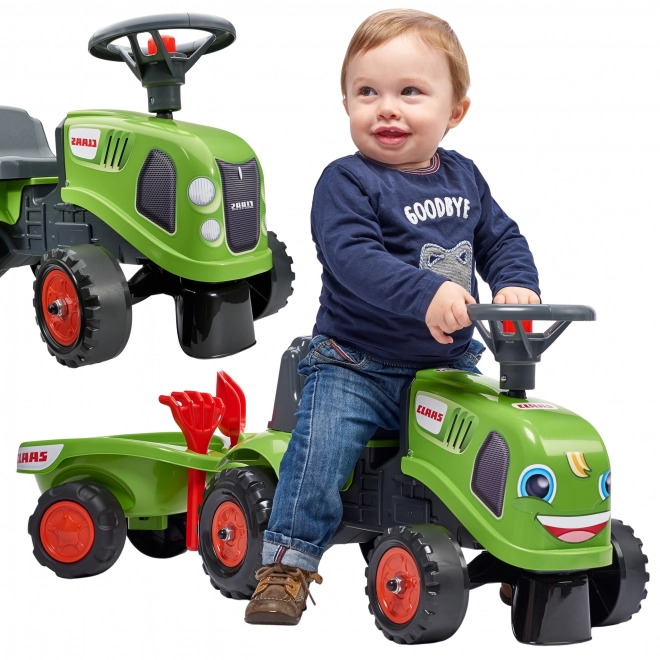 Poganjalec traktor Claas zelen z volanom in prikolico