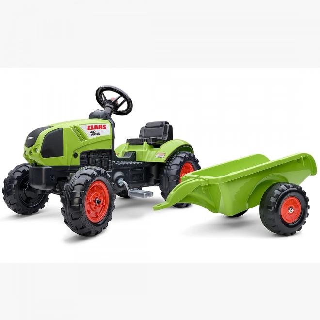 Šlapalni traktor Claas Arion 410 z zeleno prikolico