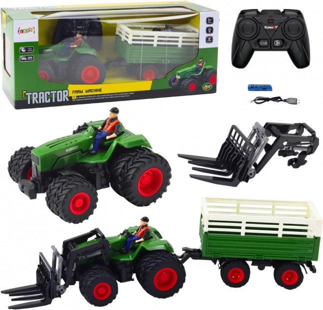 Daljinsko voden traktor s prikolico in vilicami