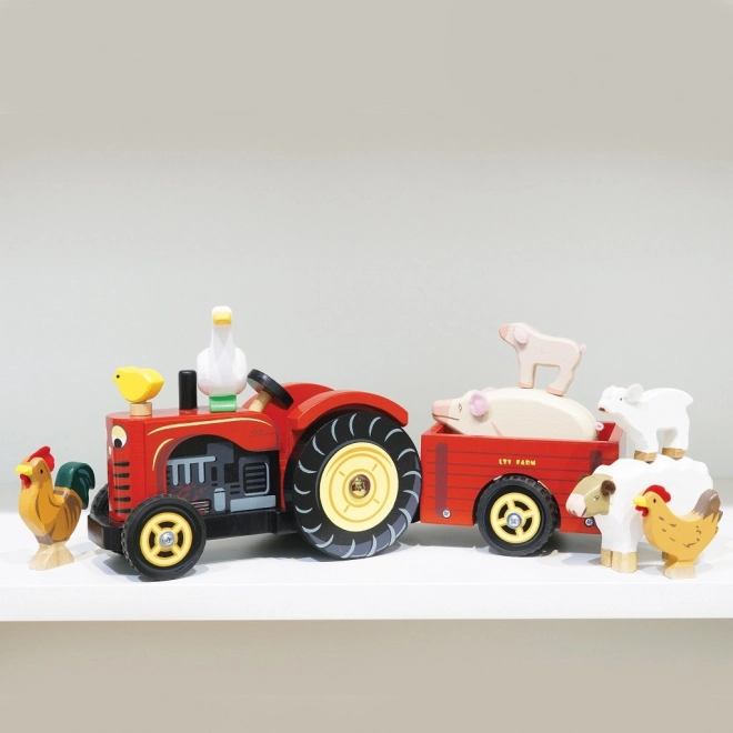 Le Toy Van rdeč traktor in prikolica