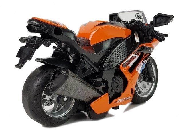 Oranžna igrača motorno kolo z pogonom