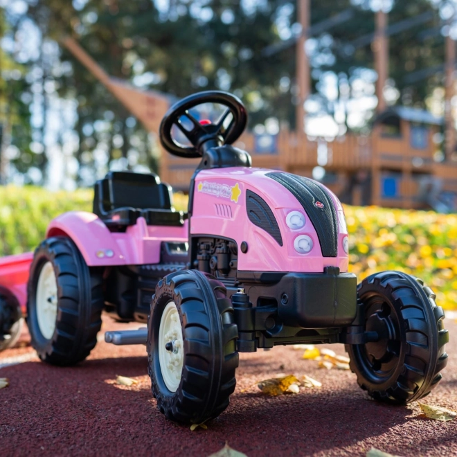 Traktor z nožnim pogonom County Star z roza prikolico
