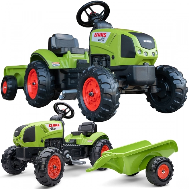 Šlapalni traktor Claas Arion 410 z zeleno prikolico