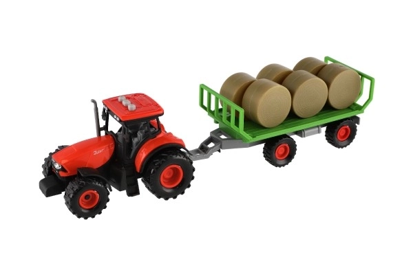 Traktor Zetor s prikolico in balami plast 36cm na vztrajnost na bat. z lučjo in zvokom v škat. 39x13