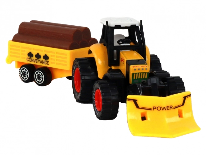 Rumeni traktor s prikolico rdeče