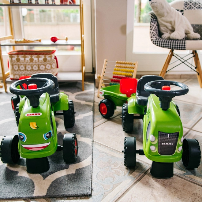 Poganjalec traktor Claas zelen z volanom in prikolico