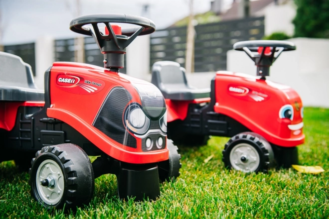 Vozeči traktor Baby Case IH rdeč s prikolico