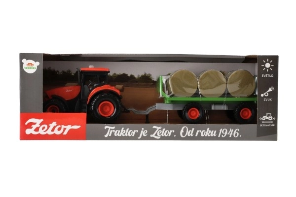 Traktor Zetor s prikolico in balami plast 36cm na vztrajnost na bat. z lučjo in zvokom v škat. 39x13