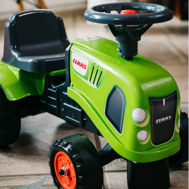 Poganjalec traktor Claas zelen z volanom in prikolico