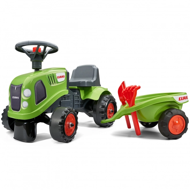 Poganjalec traktor Claas zelen z volanom in prikolico