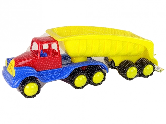 Velik tovornjak z rumeno prikolico dolžine 45 cm