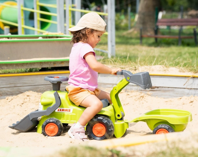 Vozni traktor Claas s prikolico, nakladalnikom in žlico