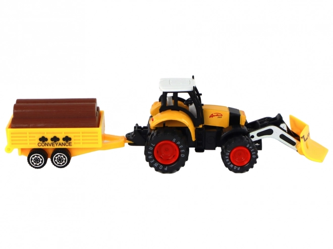 Rumeni traktor s prikolico rdeče